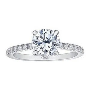 Brilliant cut solitaire engagement ring with diamond shoulders