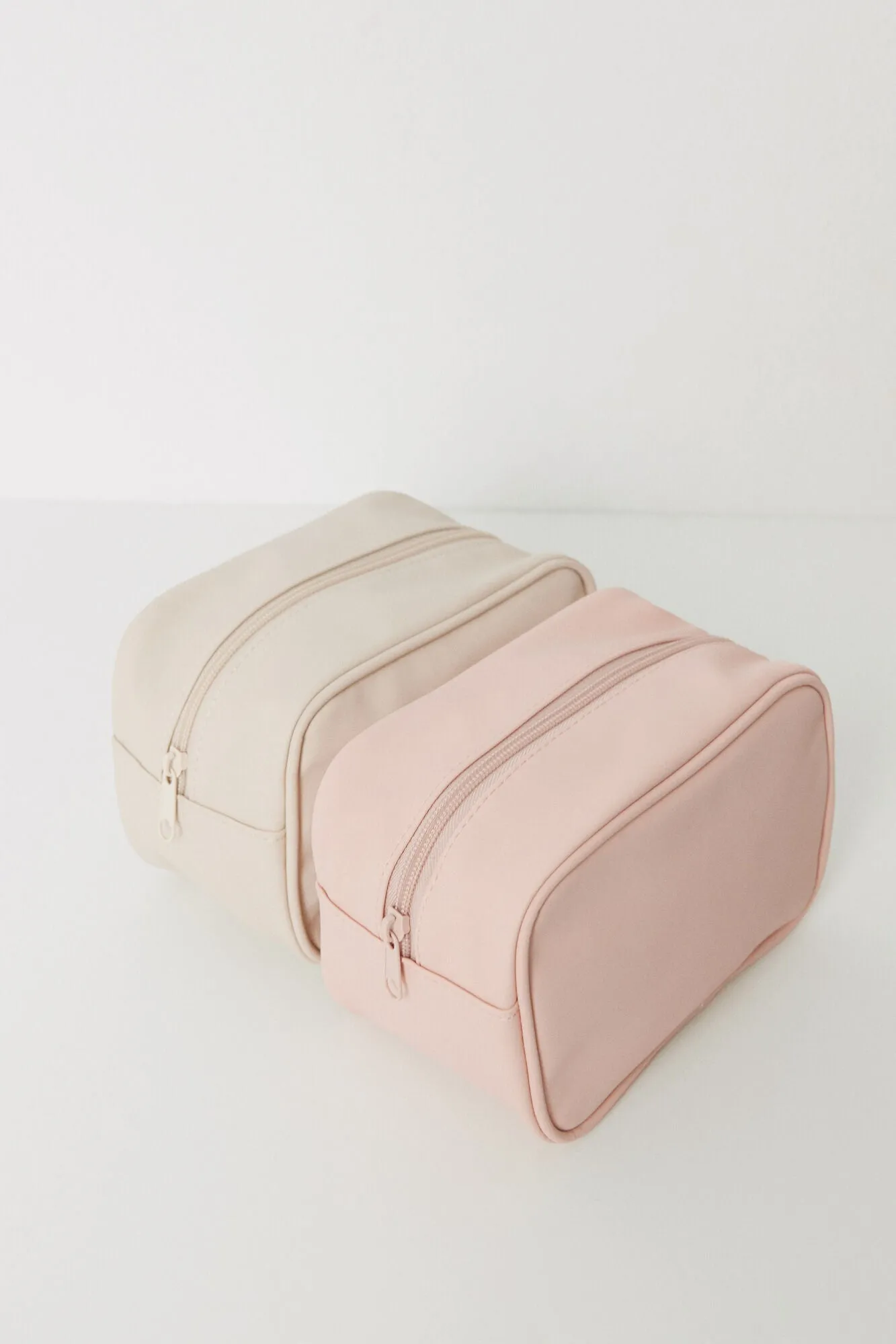 Pack of 2 small pink and beige toiletry bags